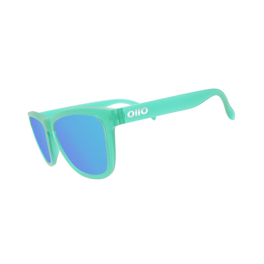 Ollo Clásico Aqua Flux sunglasses with UV400 polarised lenses and a cool aqua blue frame. Built for runners and cyclists, these lightweight, durable sunglasses feature a non-slip design and excellent optical clarity, perfect for water sports, road cycling or casual outdoor wear.