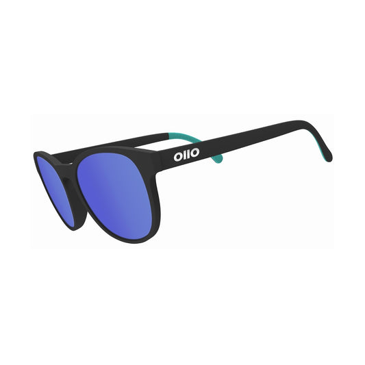 Ollo Pace Eclipse sunglasses with UV400 polarised lenses and a bold black frame. Designed for running, cycling and intense outdoor activity, these lightweight, durable sunglasses include a non-slip fit and sharp clarity, perfect for high-speed rides, alpine trails, training and adventure.