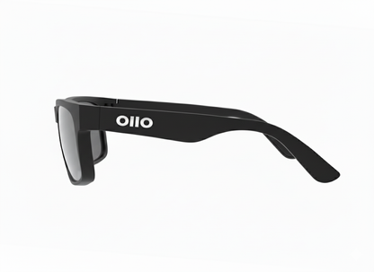 Ollo Summit Shadow sunglasses with UV400 polarised lenses and a sleek dark matte frame. Designed for runners and cyclists tackling sunrise trails and mountain paths, these lightweight, durable sunglasses deliver non-slip grip, high clarity, and comfort in harsh lighting and rugged terrain.