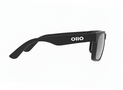 Ollo Summit Shadow sunglasses with UV400 polarised lenses and a sleek dark matte frame. Designed for runners and cyclists tackling sunrise trails and mountain paths, these lightweight, durable sunglasses deliver non-slip grip, high clarity, and comfort in harsh lighting and rugged terrain.
